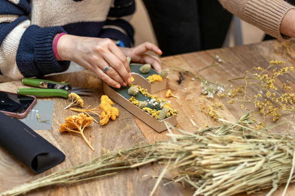 Flower Lettering Workshop. Woman working with flowers.